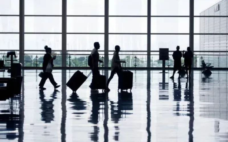 view-of-airport-departures-area-travellers-rushing